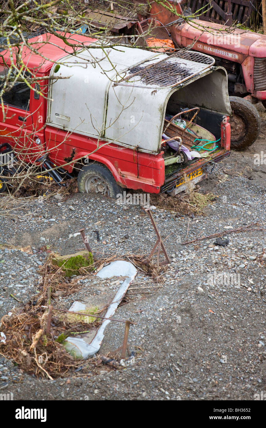 A farmers truck surrounded by flood debris from the November 2009 floods near Keswick, UK. Stock Photo