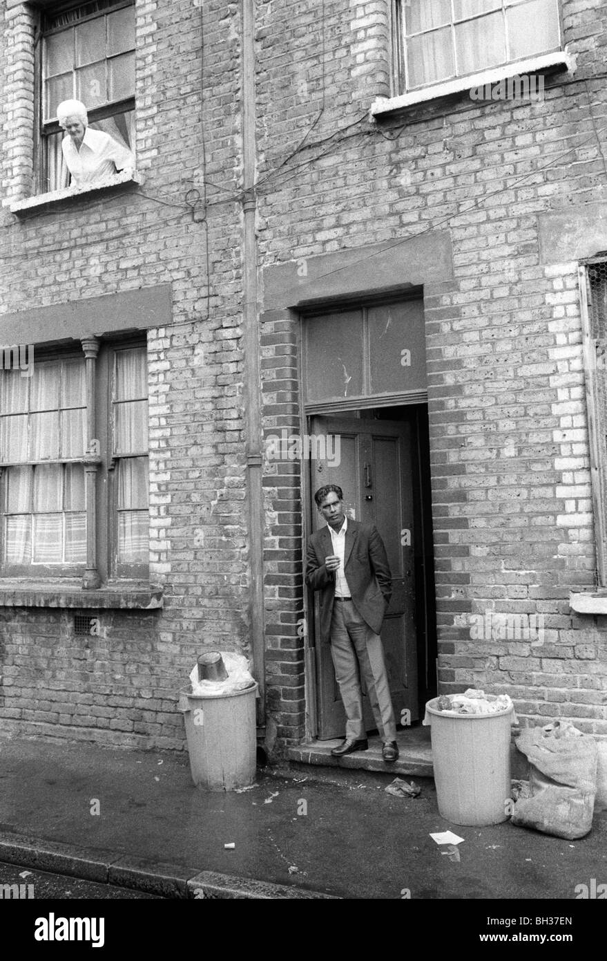 Tower Hamlets, Whitechapel East London 1970s UK. Peabody Estate, multiracial block of flats 1975 Britain.  Bengali man in doorway. HOMER SYKES Stock Photo