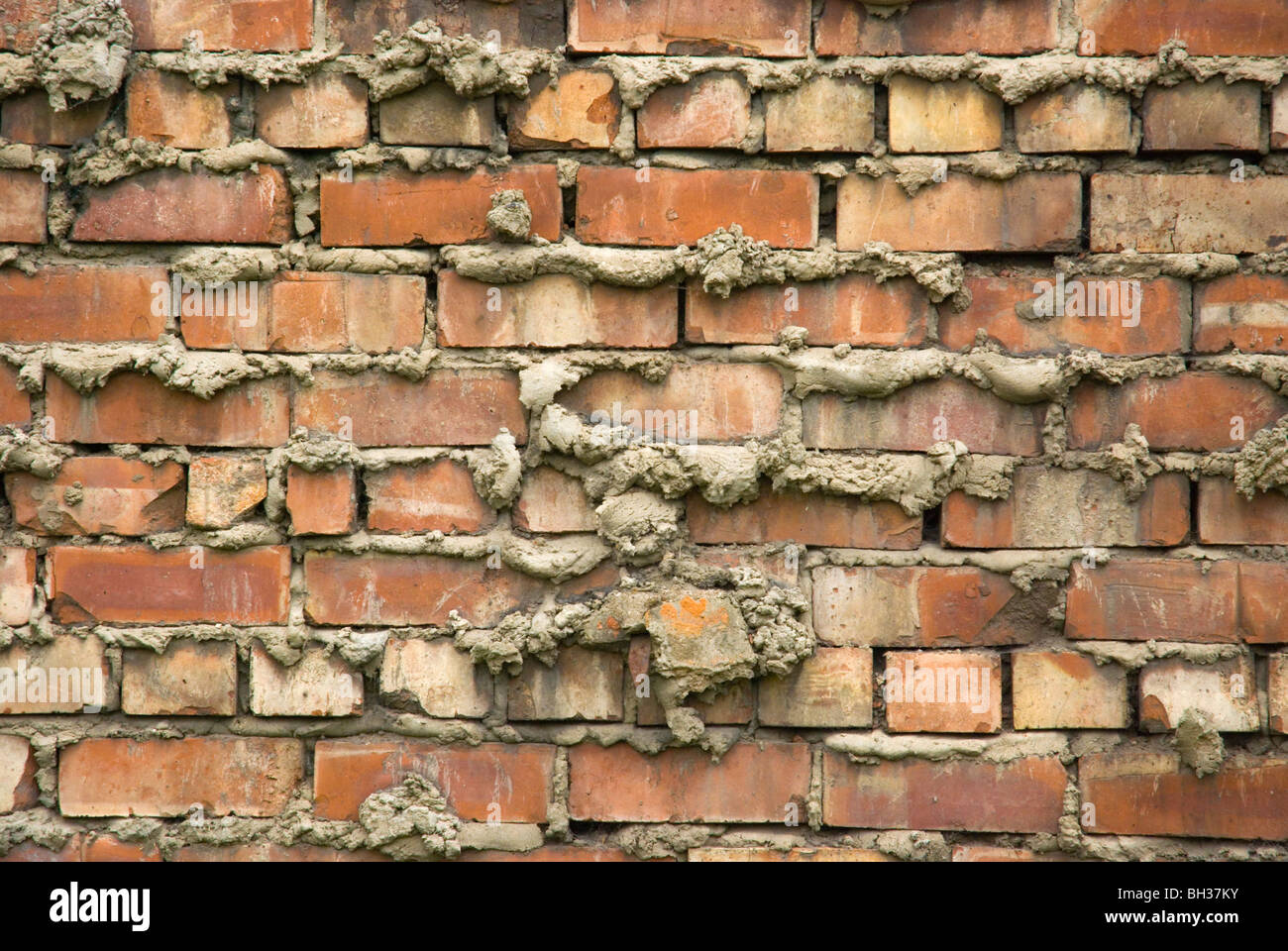 Badly plastered brick wall Salford Manchester England UK Europe Stock Photo