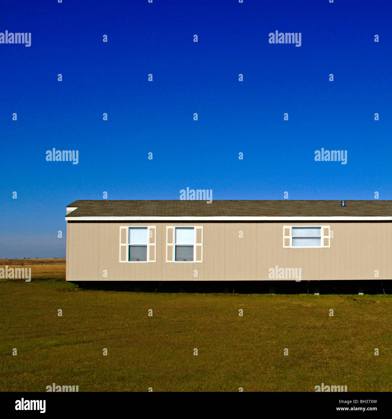 Modest mobile homes on the vast, isolated wind swept prairies of