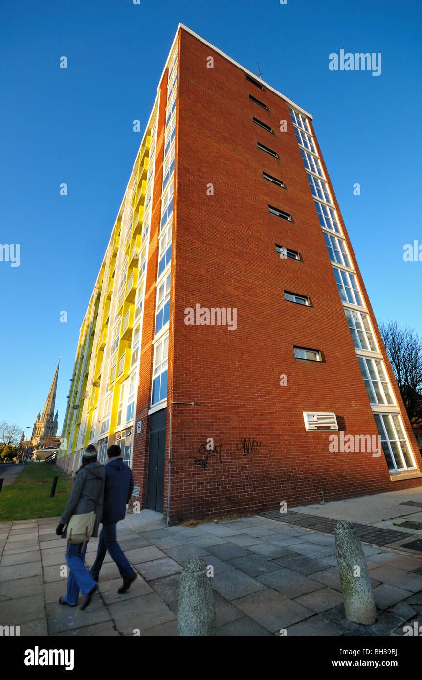 British City Council estate block of flats on a cold sunny day with 2 residents walking past, Redcliffe Bristol. Stock Photo
