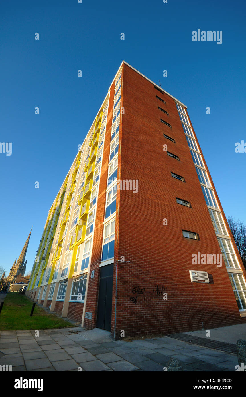 British City Council estate block of flats on a cold sunny day with a large old church in the background, Redcliffe , Bristol. Stock Photo