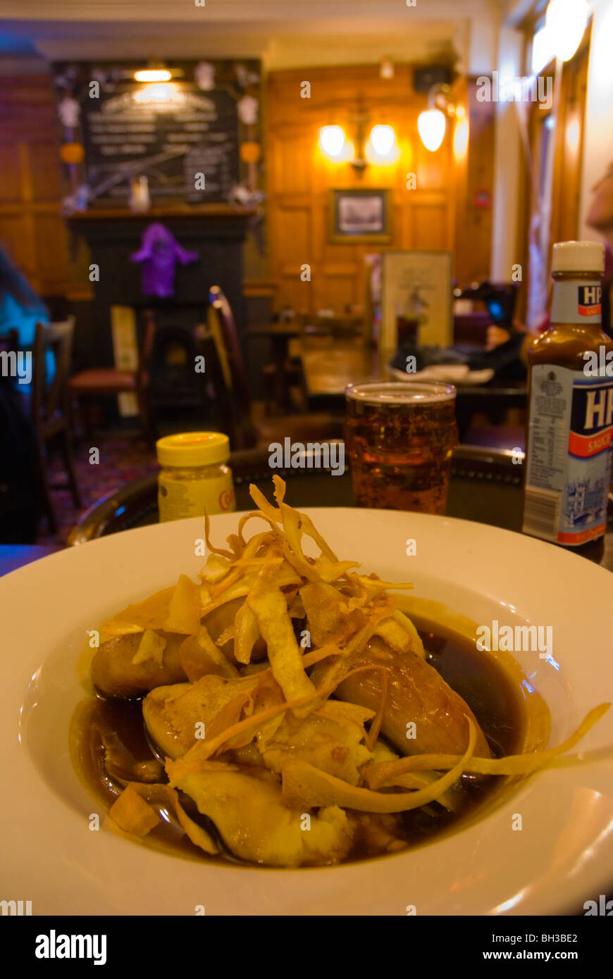 Bangers and mash with gravy and parsnip crisps Brighton England UK Europe Stock Photo