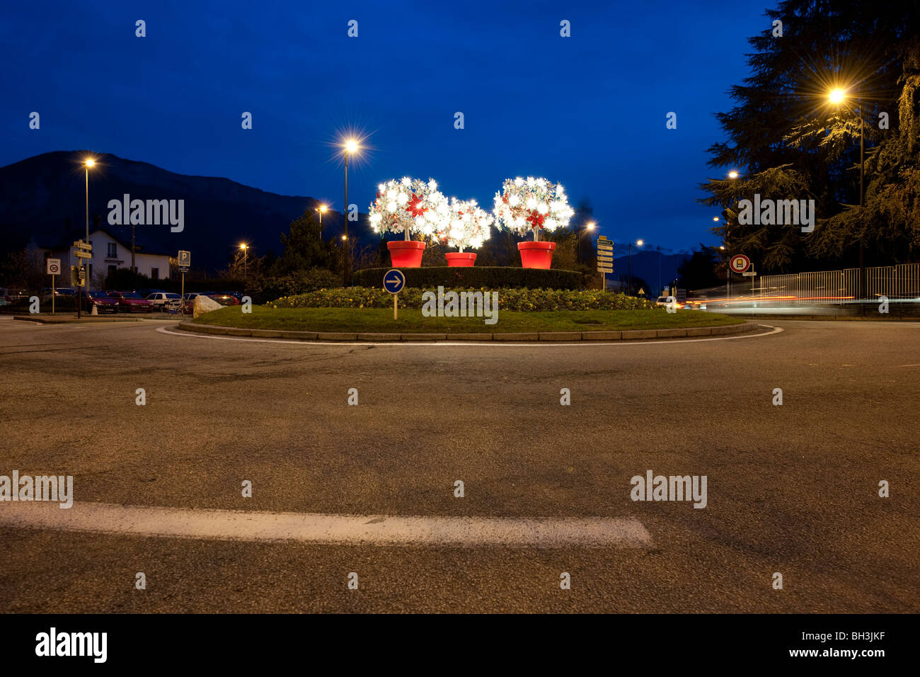 Roundabout decorated for Christmas in Annecy, France, photographed during early evening. Stock Photo