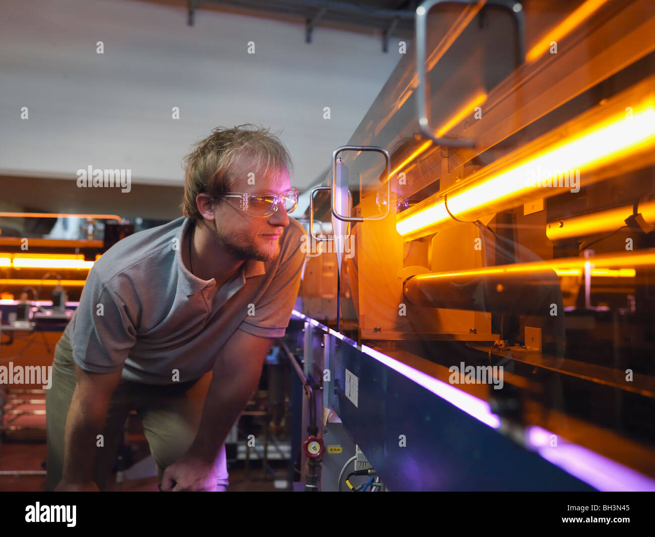 Fusion Reactor Scientist With Laser Stock Photo