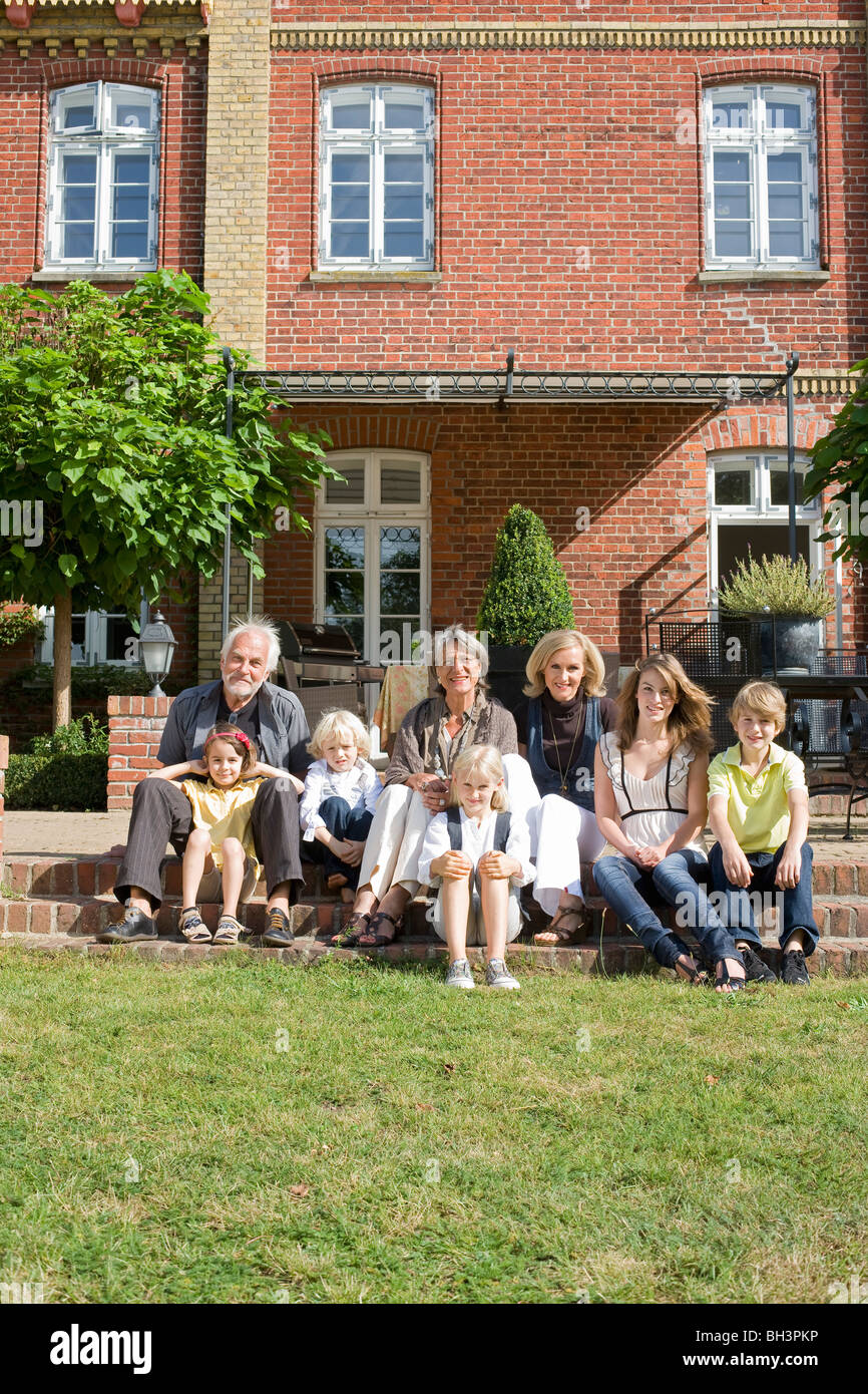 family in front of their home Stock Photo - Alamy