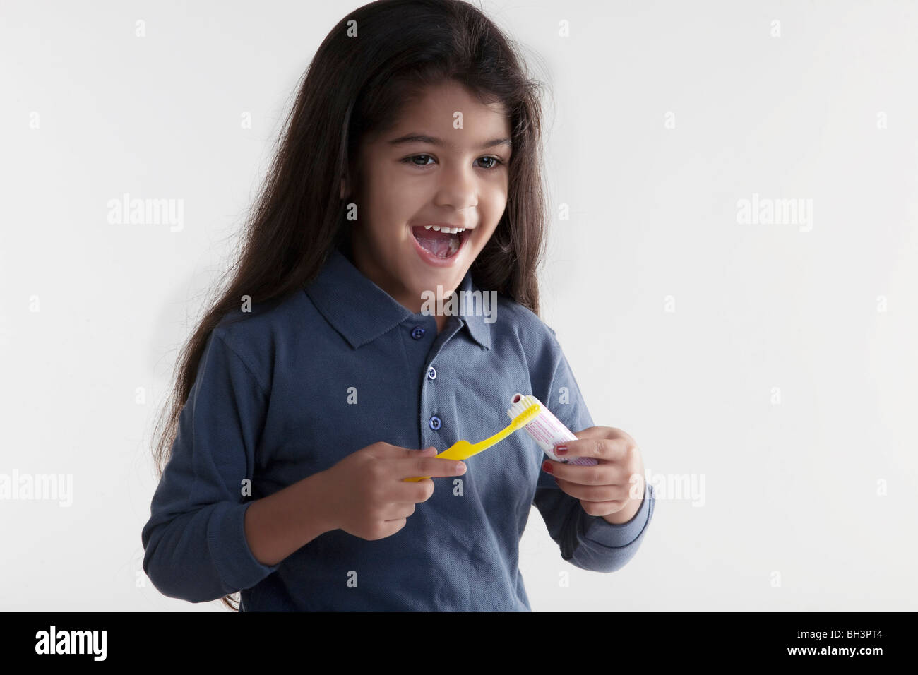 Girl with toothbrush and toothpaste Stock Photo Alamy