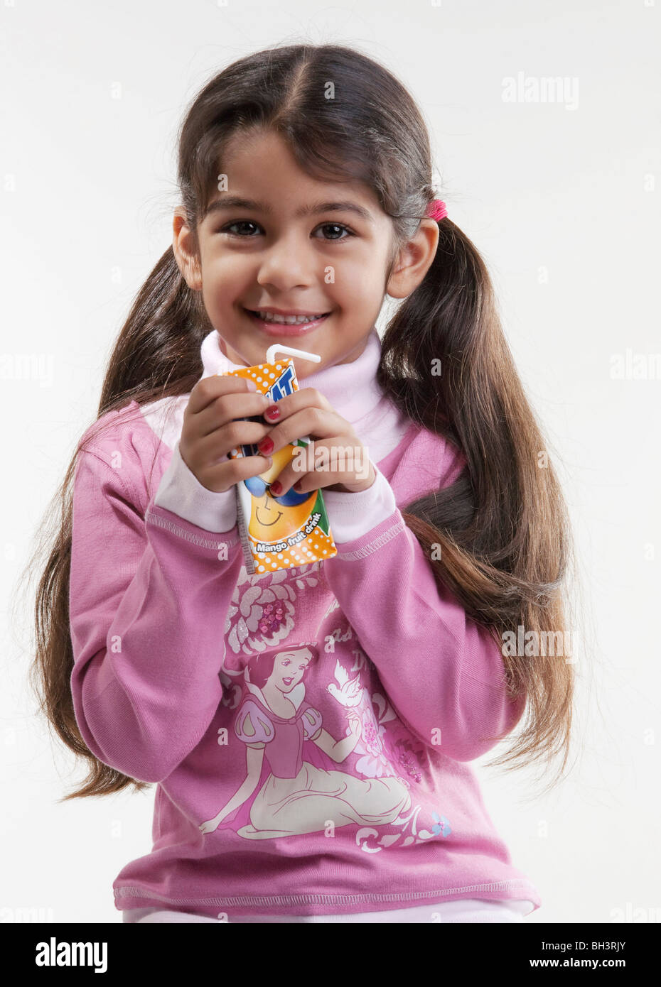 Girl having juice Stock Photo Alamy