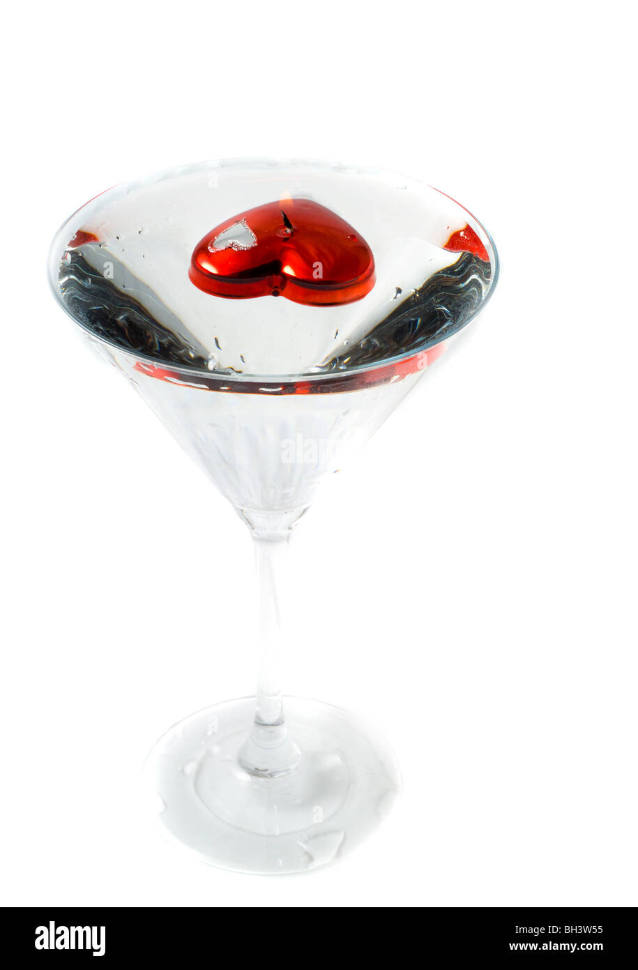 Candle in the form of heart in a glass Stock Photo