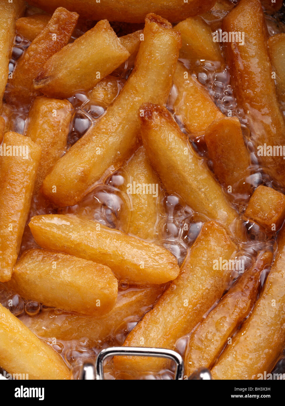 Chips deep fat frying Stock Photo Alamy