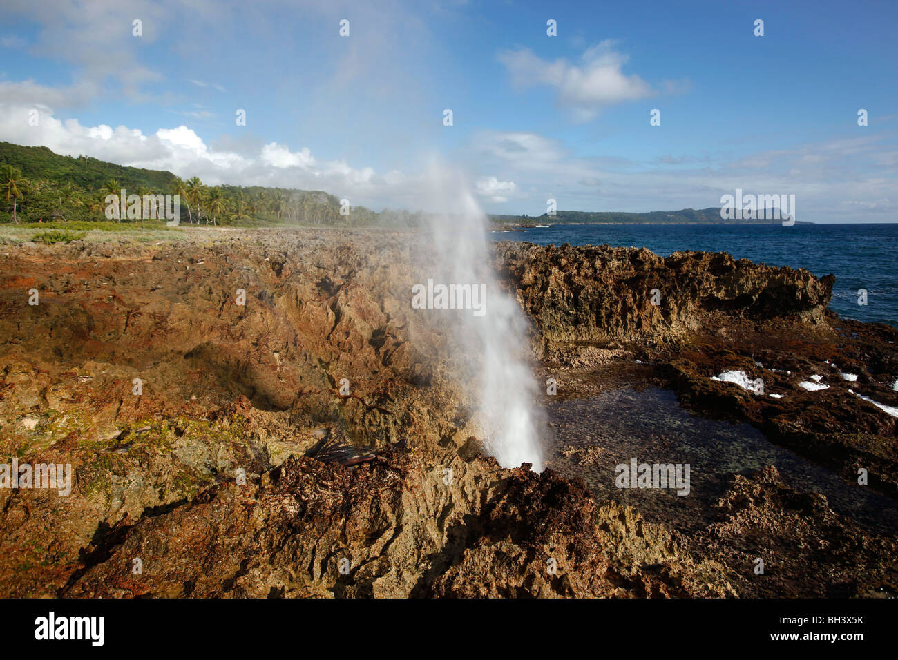 A blow hole on the coast of fossilized coral, Samana peninsula, Dominican Republic Stock Photo