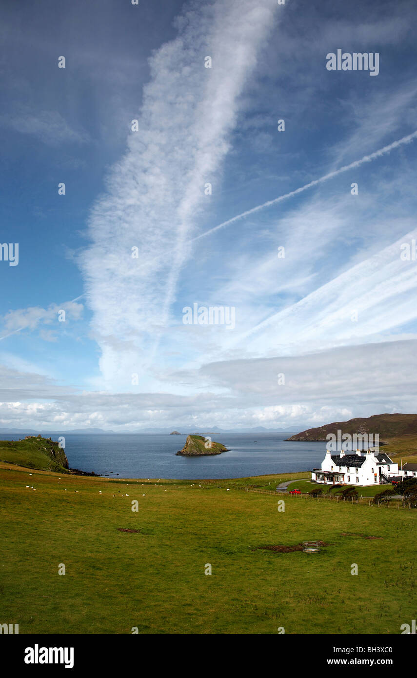 Tulm bay with Tulm castle, Duntulm hotel and the mountains of Harris in the distance. Stock Photo