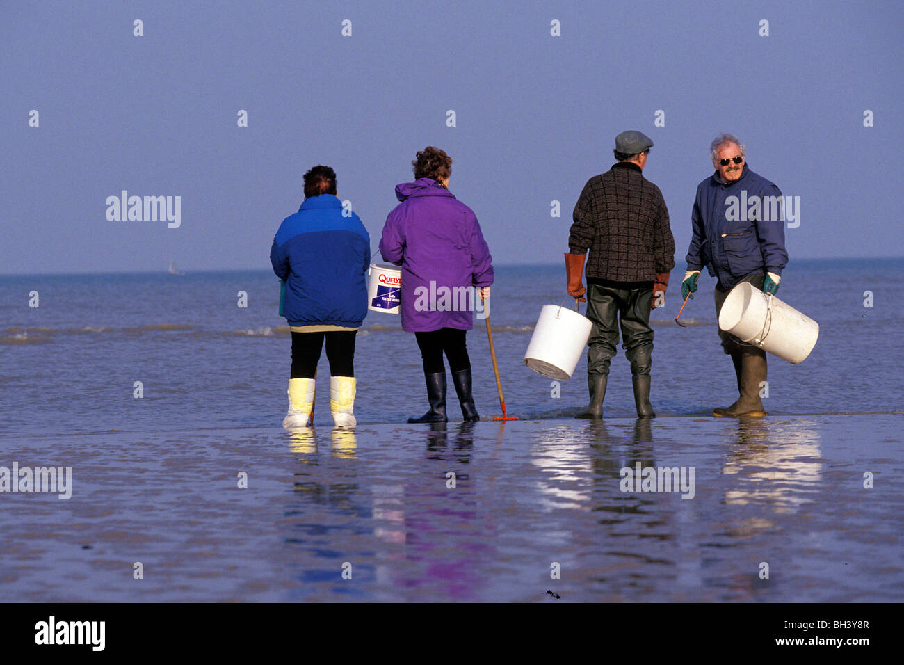 Open air activities gathering shellfish hi-res stock photography and ...