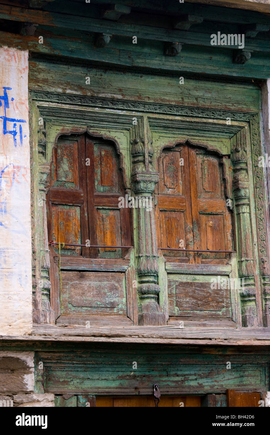 old carved window surrounds in a village near Almora Stock Photo