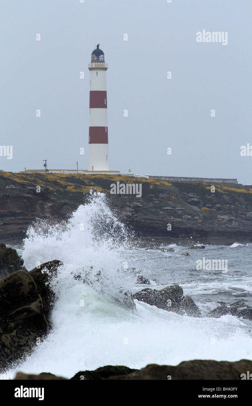 Tarbat Ness lighthouse with crashing waves. Stock Photo