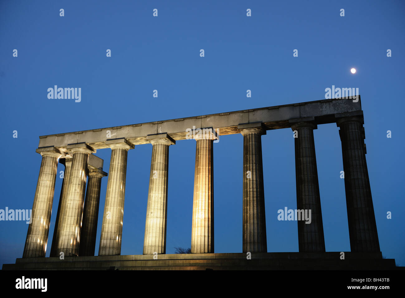 National Monument, Calton Hill, Edinburgh, Scotland, UK illuminated at dusk Stock Photo