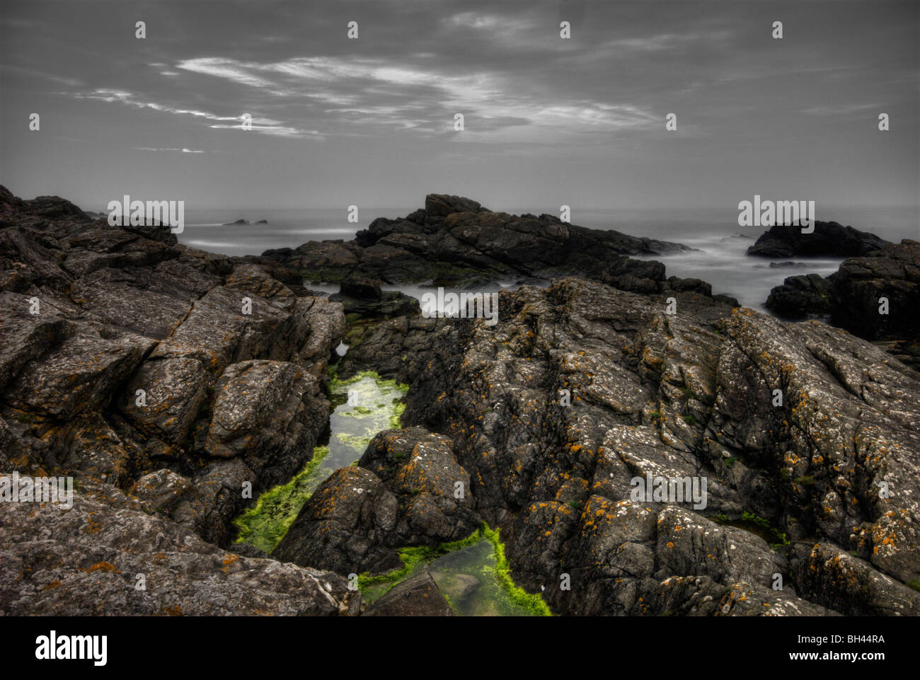 Rocks and sea in the early morning at Cove Bay; a little harbour along south coast of Aberdeen. Stock Photo