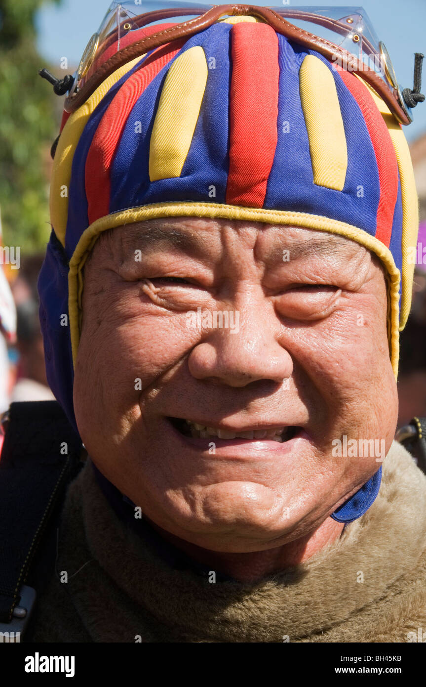 veteran skydiver after landing in his parachute at the Monkey Banquet Festival in Lopburi Thailand Stock Photo
