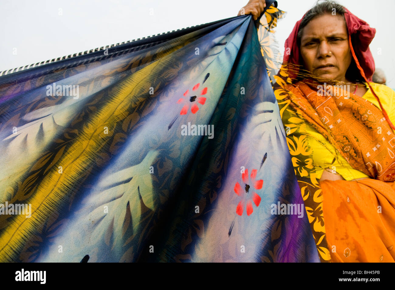 Drying up the saris during the colorful Gangasagar mela in West Bengal, India. Stock Photo