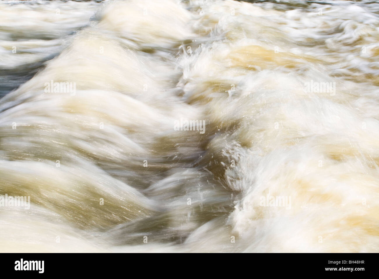 Rushing waters of the weir at Paper Mill Lock near Little Baddow. Stock Photo