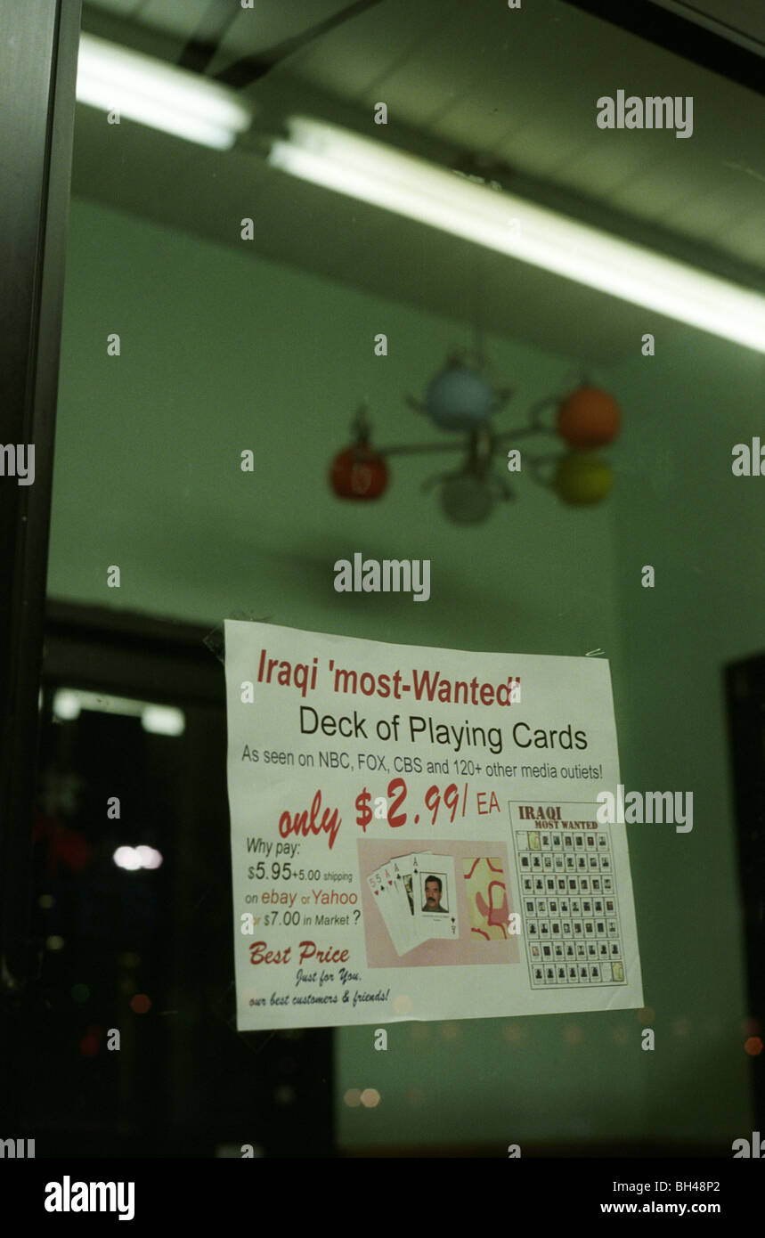 A sign on the door of a Chinese restaurant advertises Iraqi 'most-wanted' deck of playing cards for sale. Iraq Invasion War USA Stock Photo