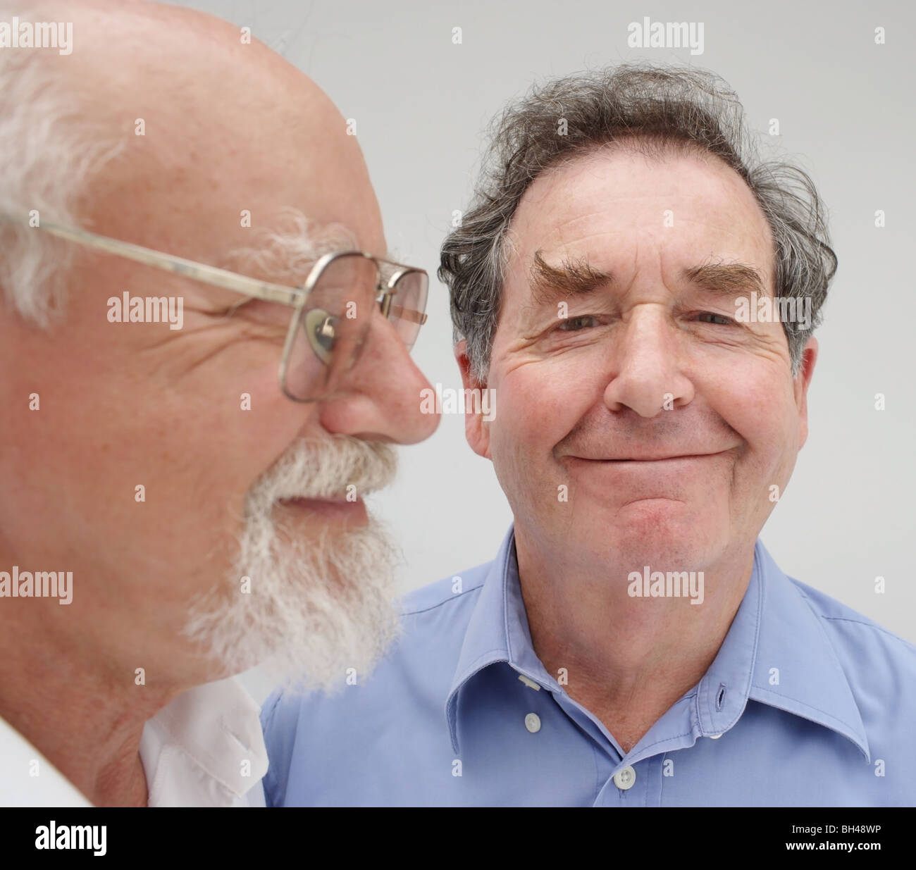 Close up portrait of two senior men, smiling Stock Photo