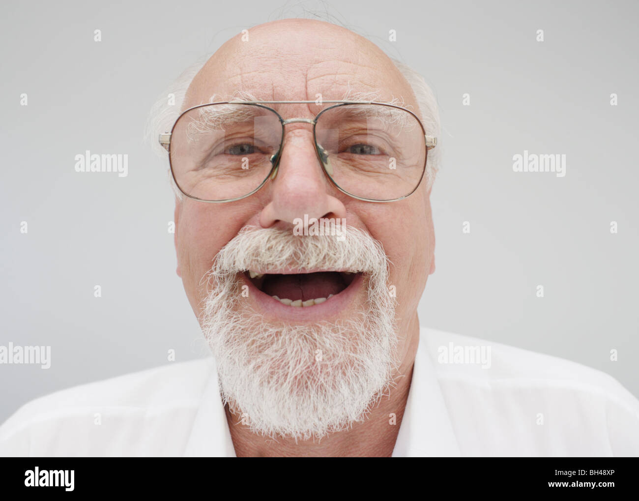 Senior businessman wearing a shirt ( age 60 to 75 years ), laughing Stock Photo