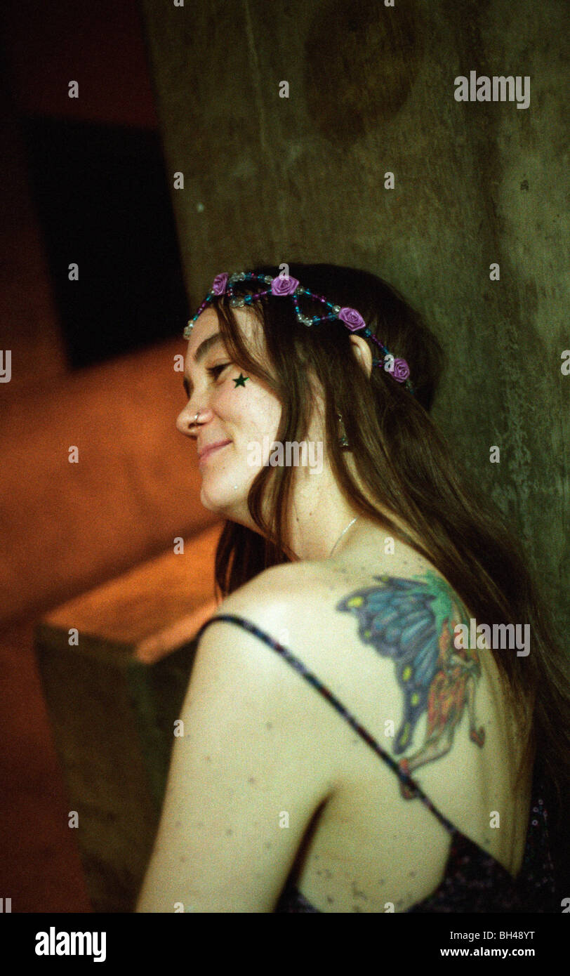 Tattooed hippy chick hanging out between sets at the last Mardi Gras Grateful Dead show in Oakland, California. Stock Photo