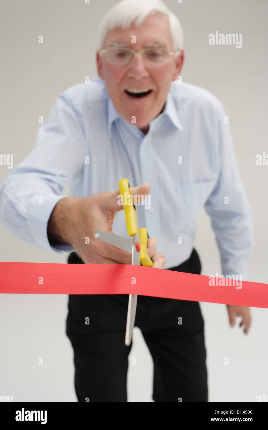 Cutting through red tape hires stock photography and images Alamy