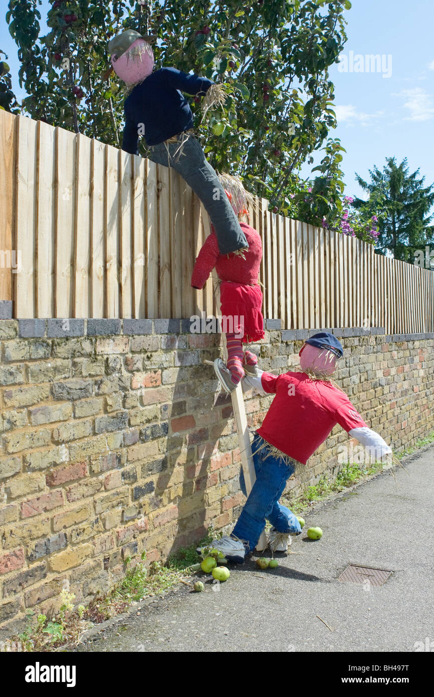 Scarecrow children scrumping apples at Flamstead Scarecrow Festival Stock Photo