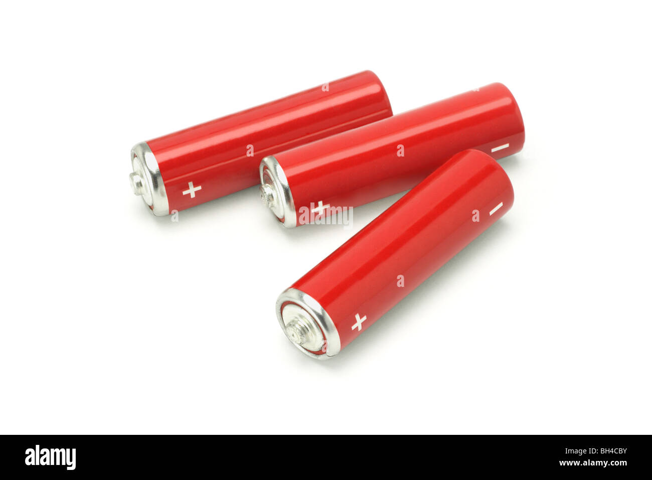 Three red AA size batteries on white background Stock Photo