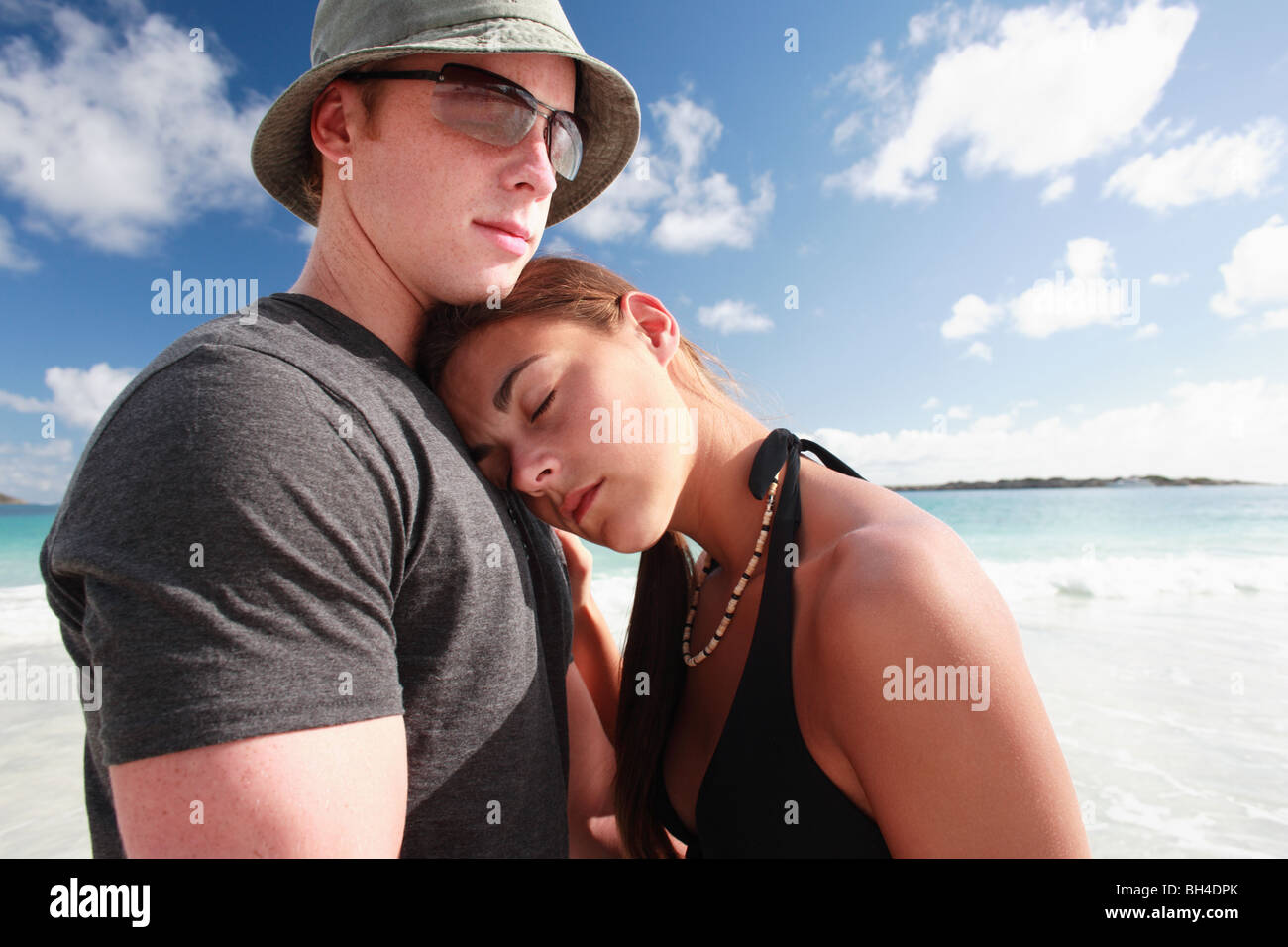 Young couple embracing on a beach Stock Photo
