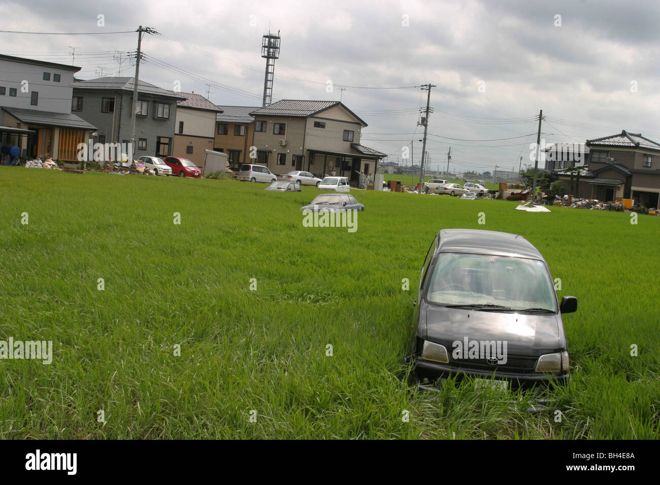 Residents of Sanjo city, clean up after a week of torrential rains forced breaks in the banks of Igarashi River, Japan. Stock Photo