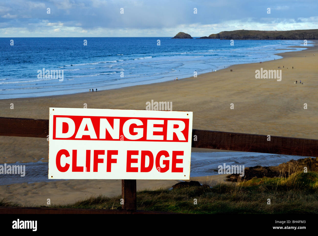 a danger sign on the cliff top at perranporth in cornwall, uk Stock Photo