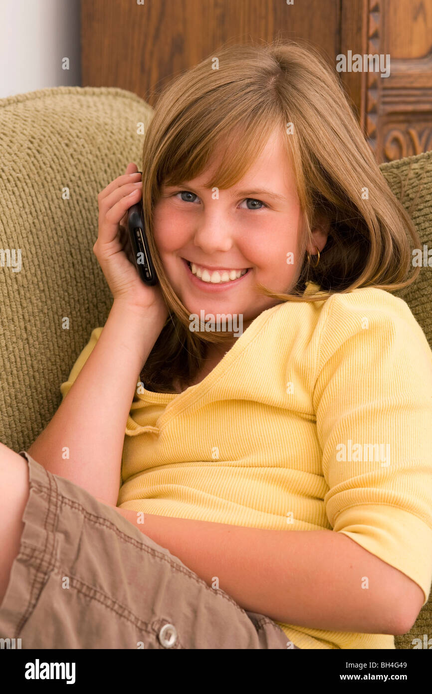 Young girl using iphone Stock Photo