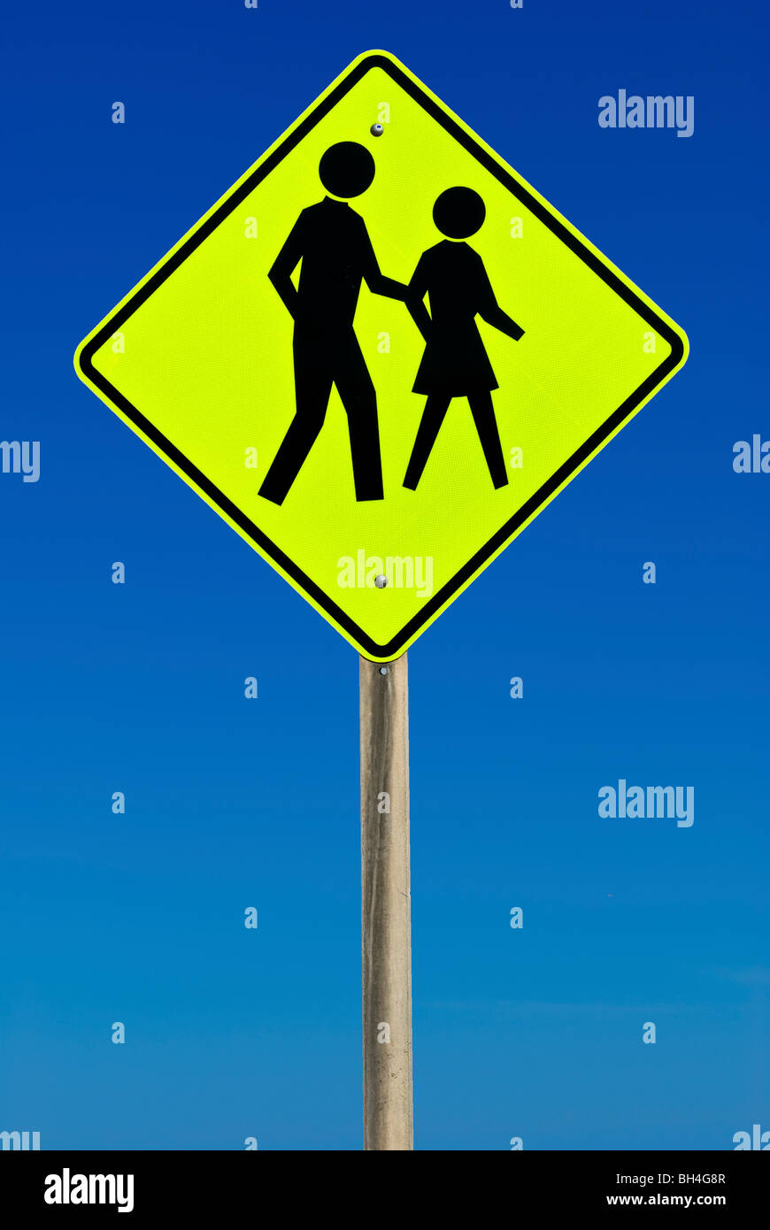 Pedestrian Crossing Sign isolated on a blue gradient sky Stock Photo