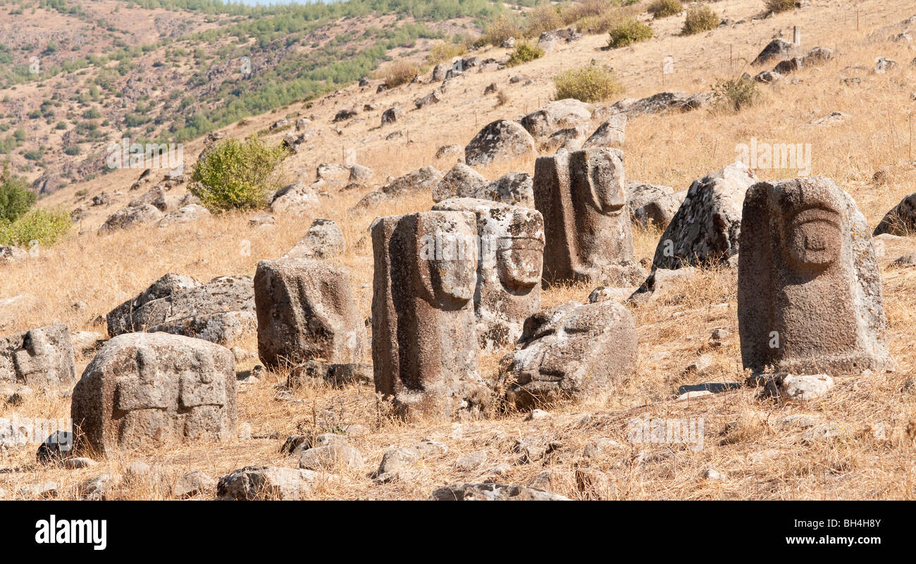 A protome gate sphinx sits amongst other sculptures at the Yesemek quarry and sculpture workshop, Turkey Stock Photo