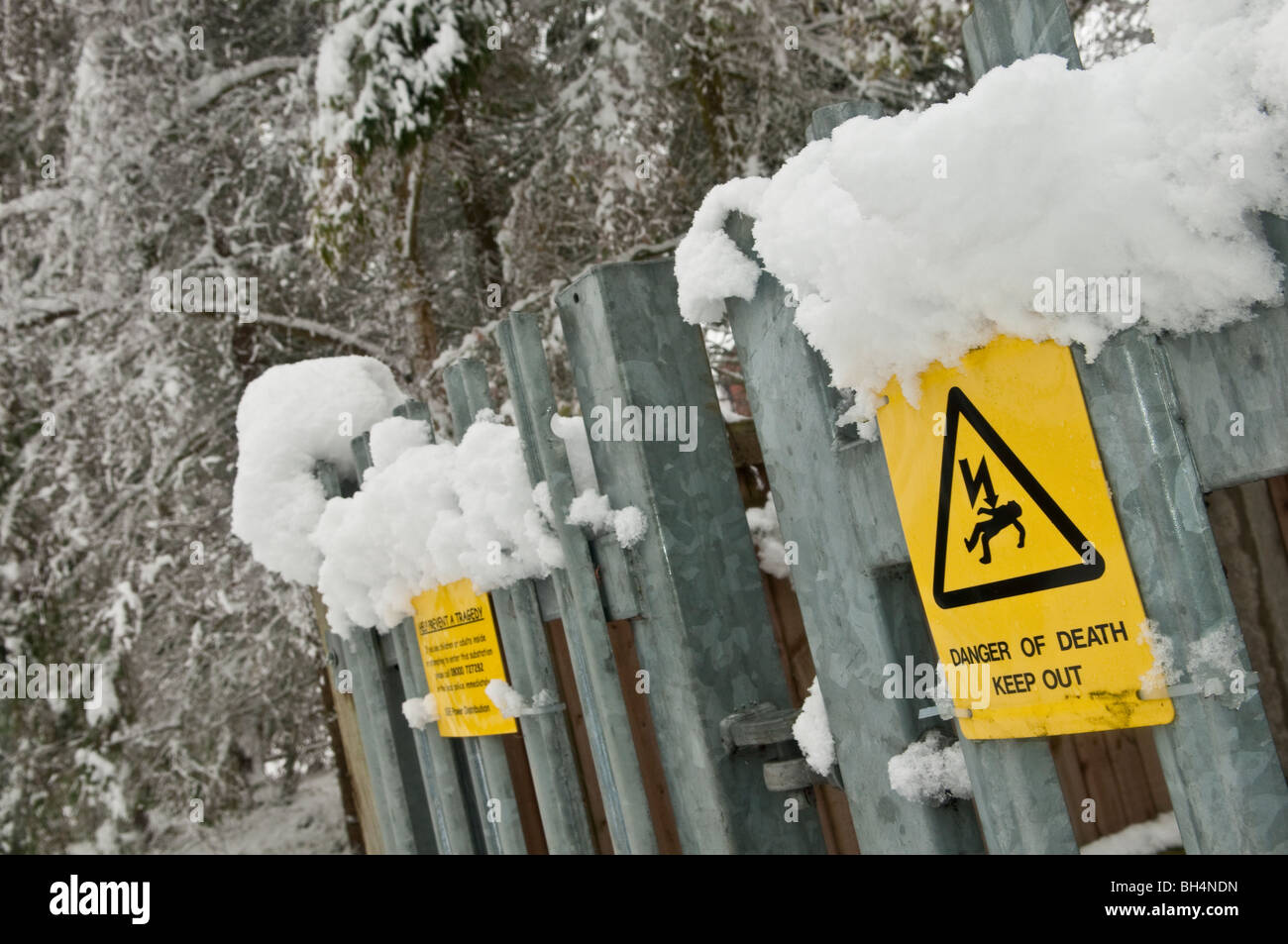 Snow on an Electricity Substation - 'Danger of Death' sign very prominent Stock Photo