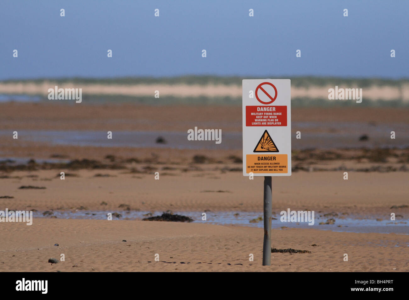 RAF bombing range warning sign on beach. Stock Photo