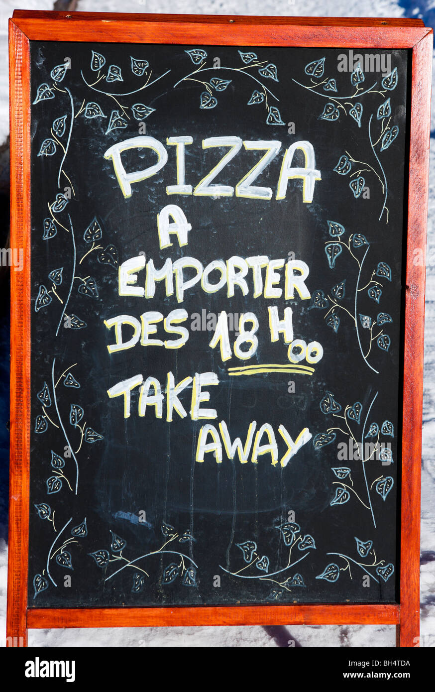 Menu sign for takeaway pizza in the centre of the resort, Arc 1800, Les Arcs, Tarentaise, Savoie, France Stock Photo