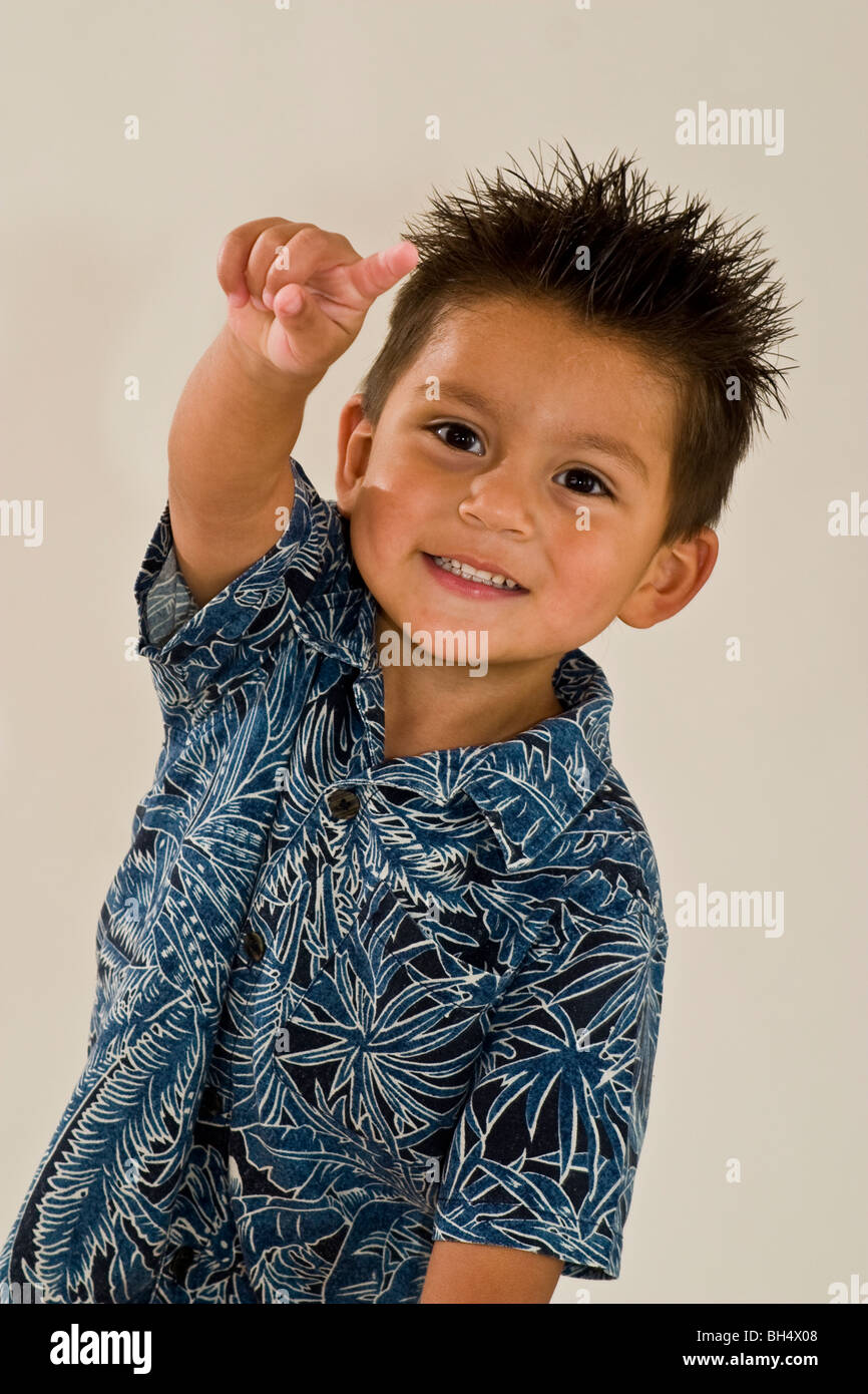 Hispanic 3 year old boy pointing at camera studio shot. MR  © Myrleen Pearson Stock Photo