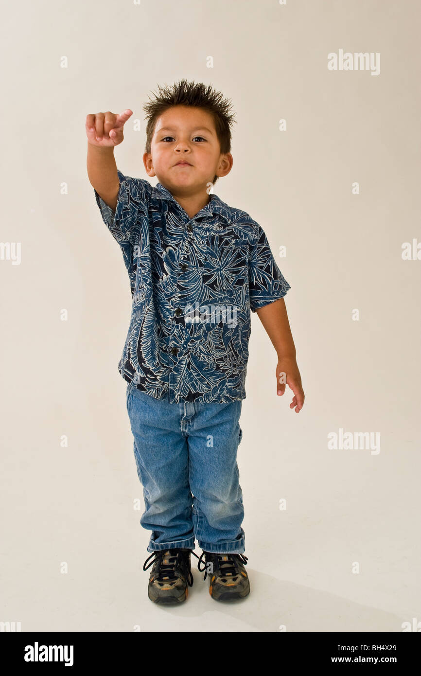 little boy Hispanic 3-4 year old boy pointing  studio shot. MR  © Myrleen Pearson Stock Photo