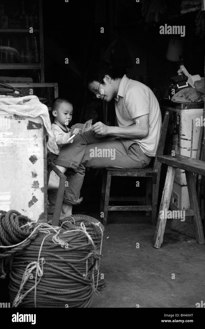 Mother teaching son, China Stock Photo