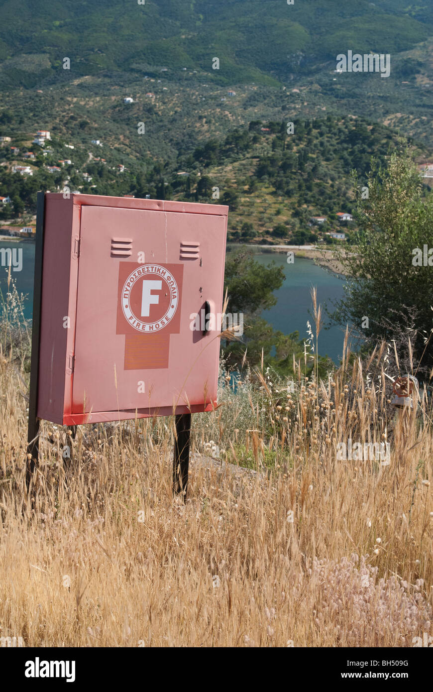 Fire hose box and hydrant on Poros Island, Greece Stock Photo