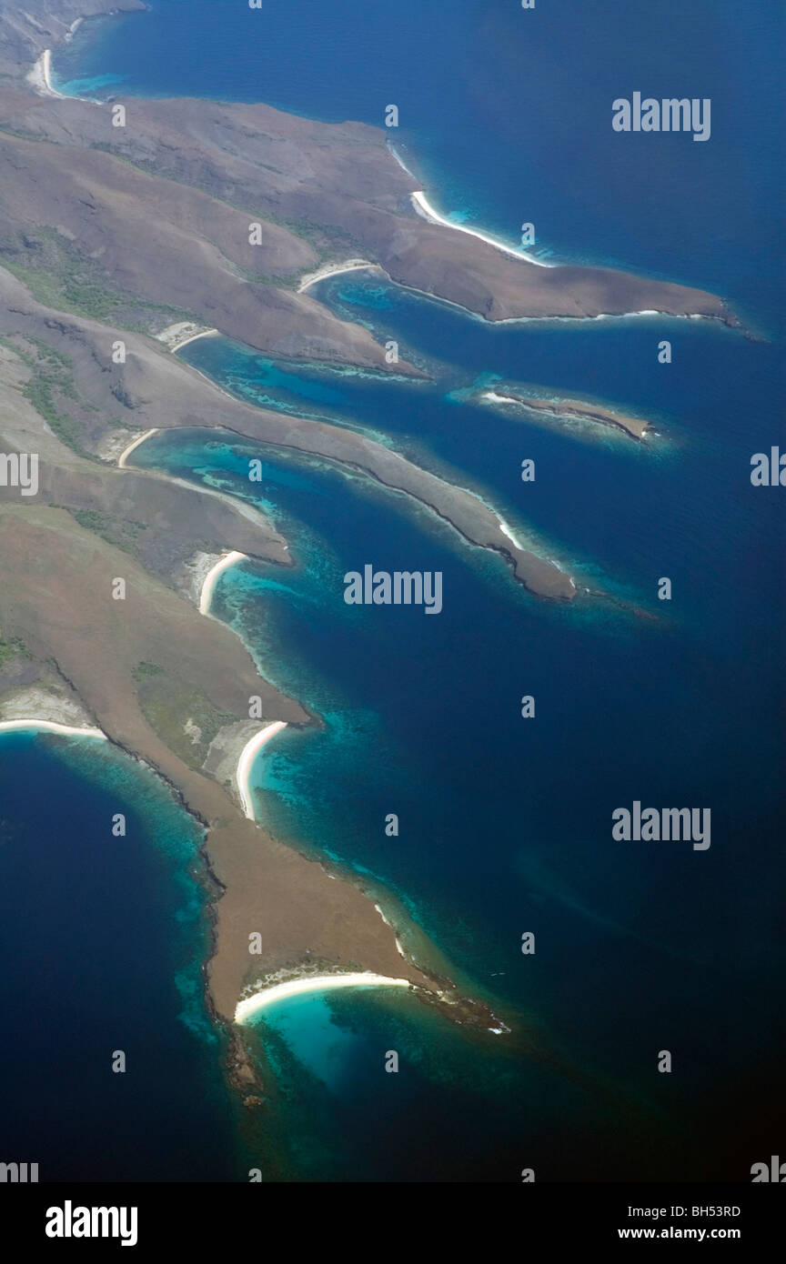 Aerial view of spectacular coastline and fringing coral reefs of Banta Island, Komodo Marine Park, Indonesia Stock Photo