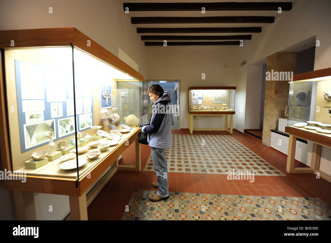 woman looking at exhibit in the Soler Blasco Museum, Javea / Xabia, Alicante, Comunidad Valenciana, Spain Stock Photo