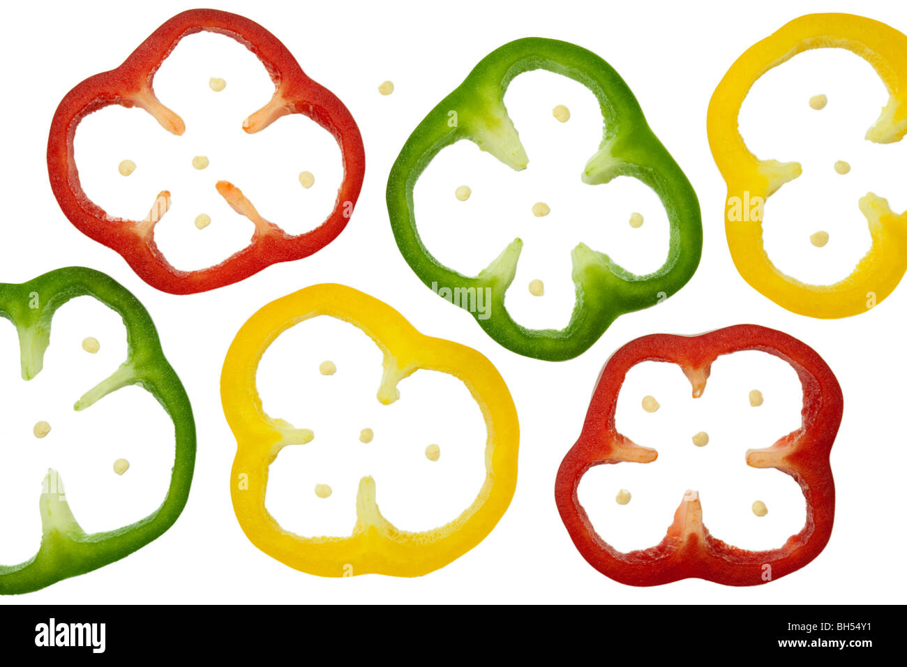 Sliced red, green and yellow peppers isolated on white Stock Photo - Alamy