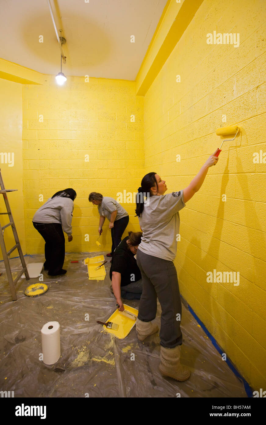 Volunteers Paint Room in High School Stock Photo Alamy