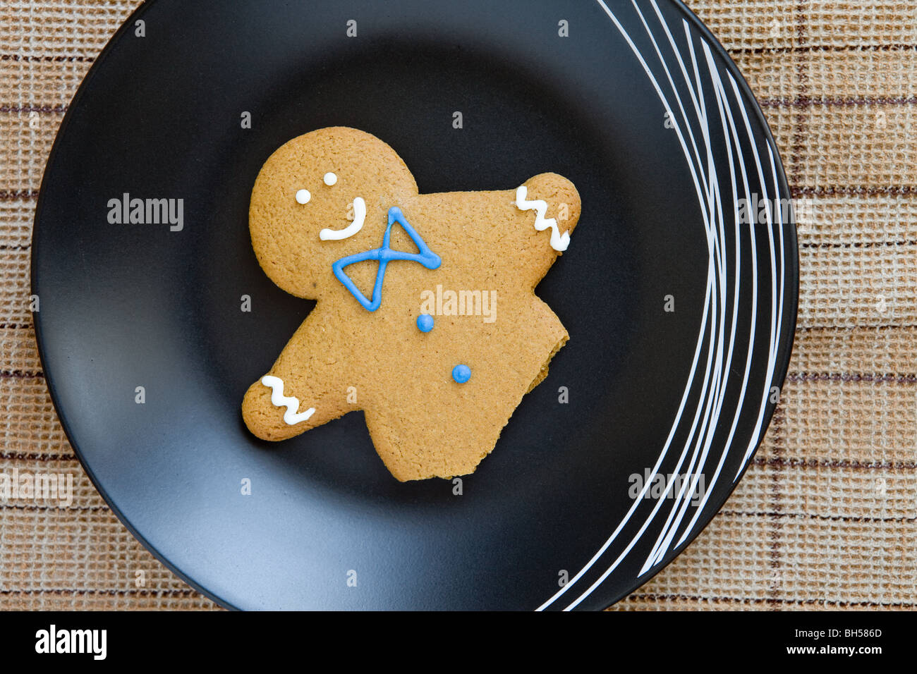 ginger bread man remains on the plate Stock Photo