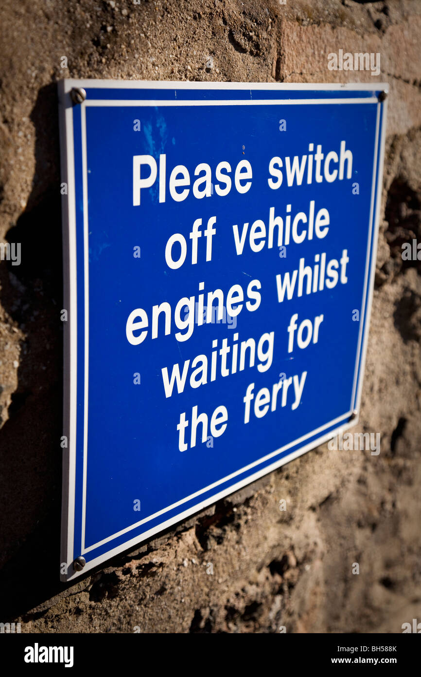 The historic Lower Ferry showing a Notice asking Drivers to switch off vehicle engines whilst waiting for the Ferry, Dartmouth, Devon, England, UK Stock Photo